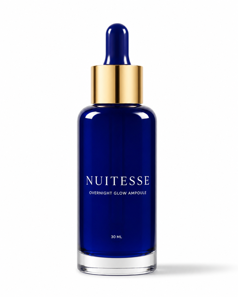 Nuitesse Overnight Glow Ampoule in a cobalt blue 30 ml glass dropper bottle with a gold collar, on a white background